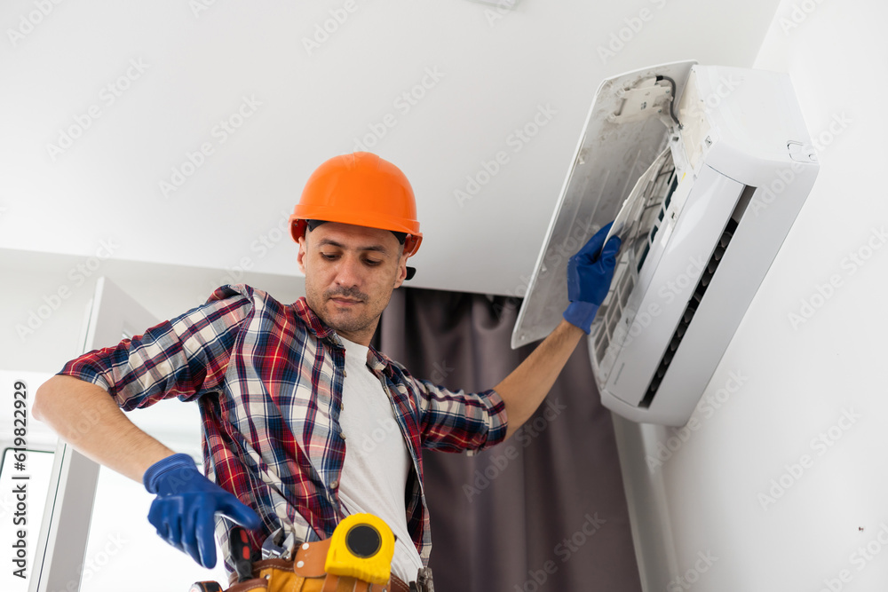Air technicians are checking air conditioning. Air technicians are checking air conditioning.