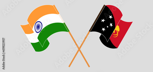 Crossed and waving flags of India and Papua New Guinea
