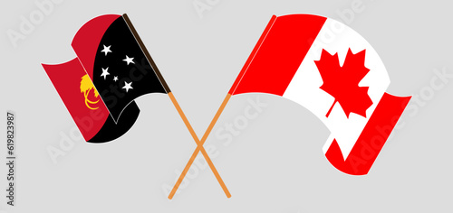 Crossed and waving flags of Papua New Guinea and Canada