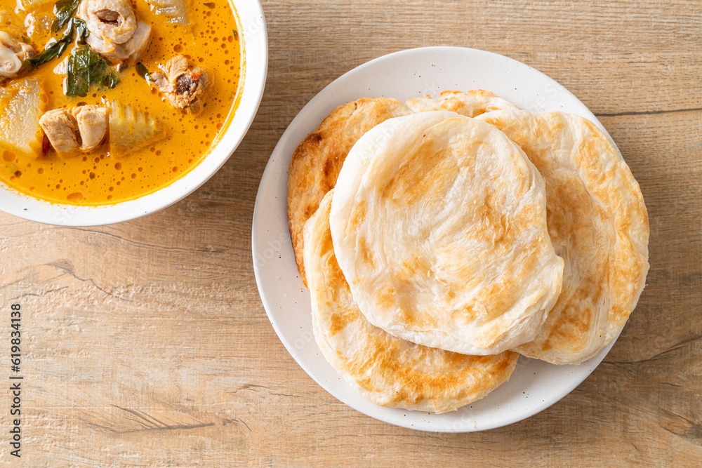 Chicken curry soup with roti Chicken curry soup with roti