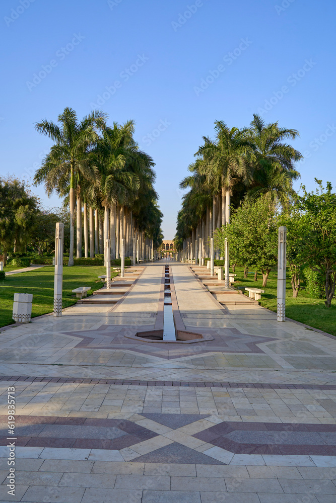 Fototapeta premium Promenade lined with palms in Al-Azhar Park, Cairo, Egypt