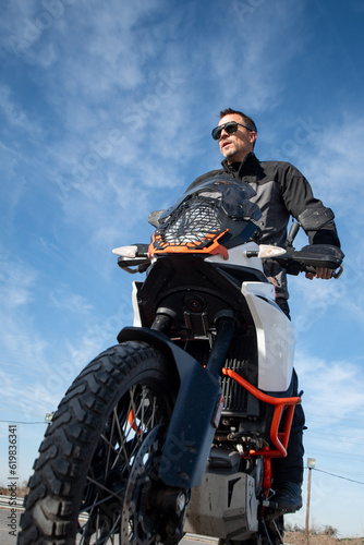 Quadro em tela Vertical photograph of motorcycle instructor with contrapposto shot