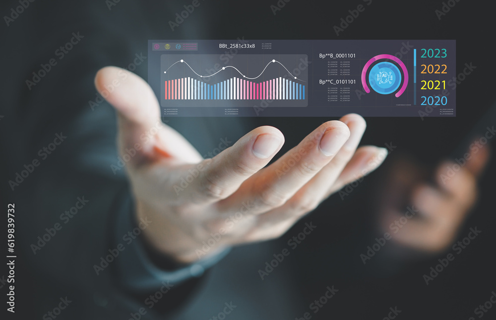 Big Data Technology for Business Finance Analytic Concept. Modern graphic interface shows massive information of business sale report, profit chart and stock market trends analysis on screen monitor.
