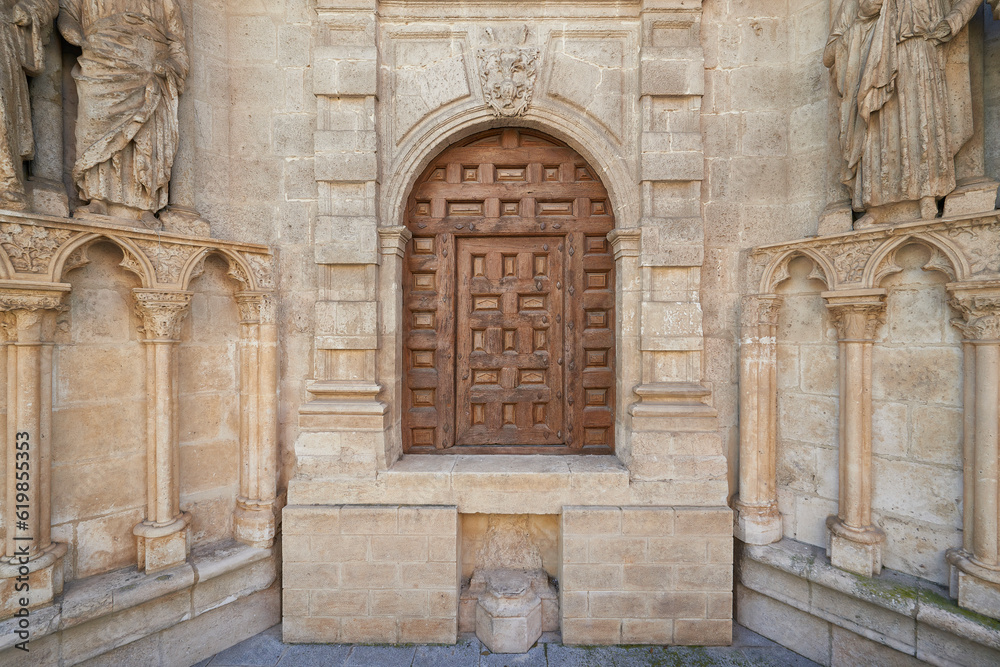 Small wooden door on the facade of the Cathedral of Burgos
