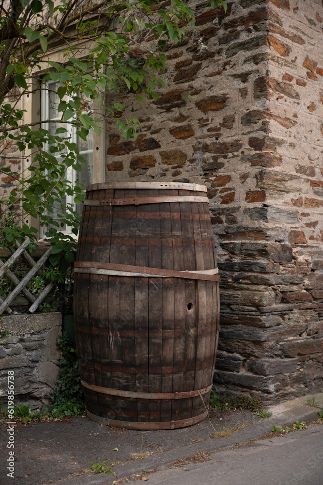 an old wine or whiskey barrel outside under a tree in Germany an old wine or whiskey barrel outside under a tree in Germany
