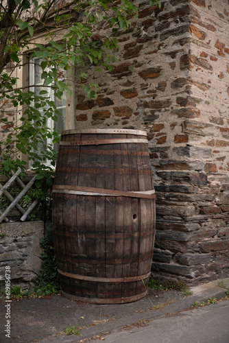 an old wine or whiskey barrel outside under a tree in Germany