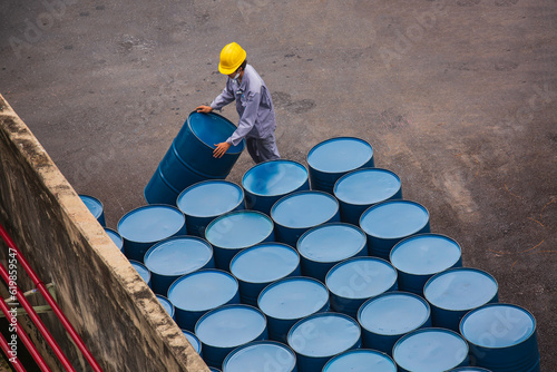 Canvas Print Top view oil barrels vertical move for on the male worker help