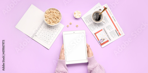 Female hands holding tablet...