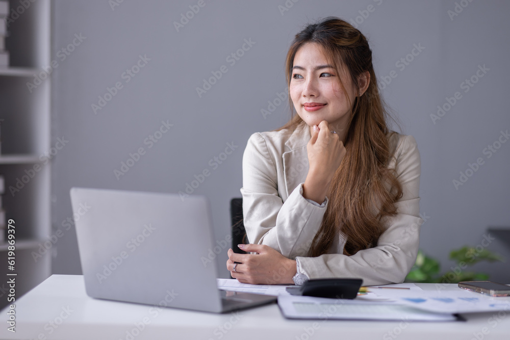 Financial Business asian women analyze the graph of the company's performance to create profits and growth, Market research reports and income statistics, Financial and Accounting concept. Financial Business asian women analyze the graph of the company's performance to create profits and growth, Market research reports and income statistics, Financial and Accounting concept.