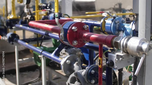 Refinery factory inside. Modern equipment, steel tanks and boilers with cables, pipelines and valves for chemical mixing.natural gas oil energy industry video concept