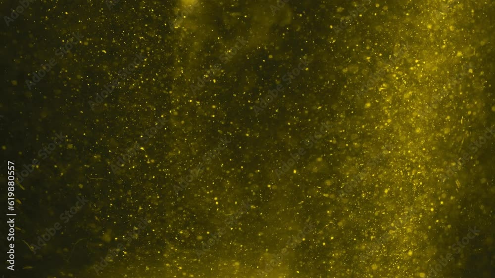 Yellow Particles Flying In A Dark Space - Background Of Golden Particles Floating In The Dark Yellow Particles Flying In A Dark Space - Background Of Golden Particles Floating In The Dark