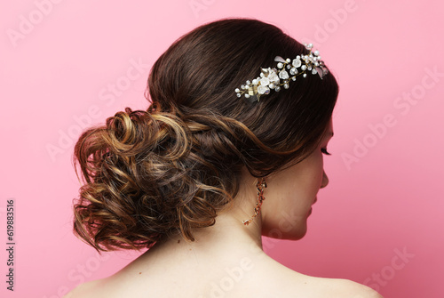 jewelry, luxury, wedding and people concept: young bride with gorgeous diadem in her hair.