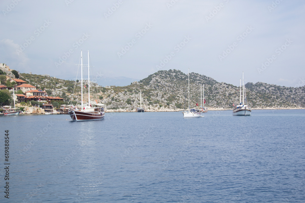 Beautiful view of the sea bay and pleasure yachts on a sunny summer day, in Turkey Beautiful view of the sea bay and pleasure yachts on a sunny summer day, in Turkey