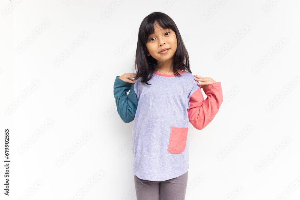 Smiling beautiful girl holding the shoulders, isolated on white background