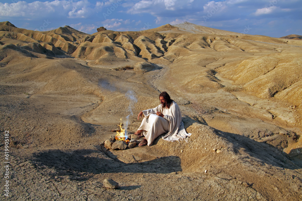 Fototapeta premium Jesus meditating alone in a desert. Biblical concept.