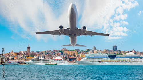 Airplane in the sky flying over Istanbul city - Luxury cruise ship in Bosporus against istanbul city with - Istanbul, Turkey