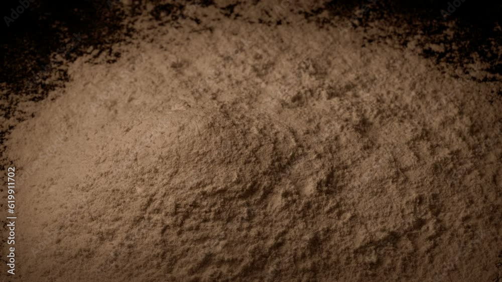 Chocolate Powder Is Poured Into Pile
Chocolate Powder Is Poured Into Pile