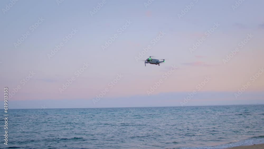 Shooting a drone flight over the coastline along the sea during sunset Shooting a drone flight over the coastline along the sea during sunset