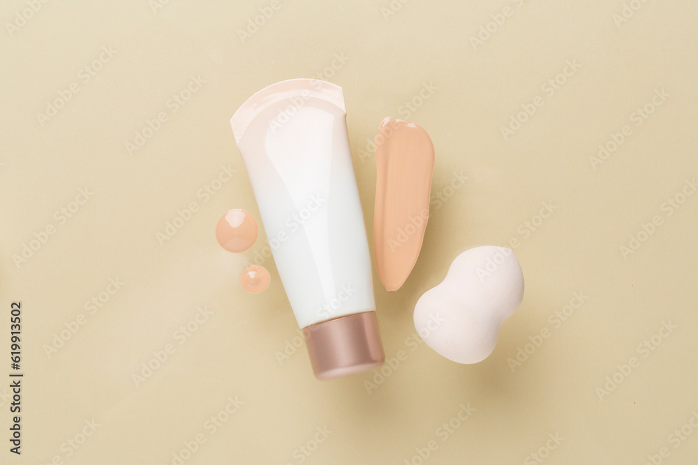 Composition with makeup foundation on color background, top view Composition with makeup foundation on color background, top view