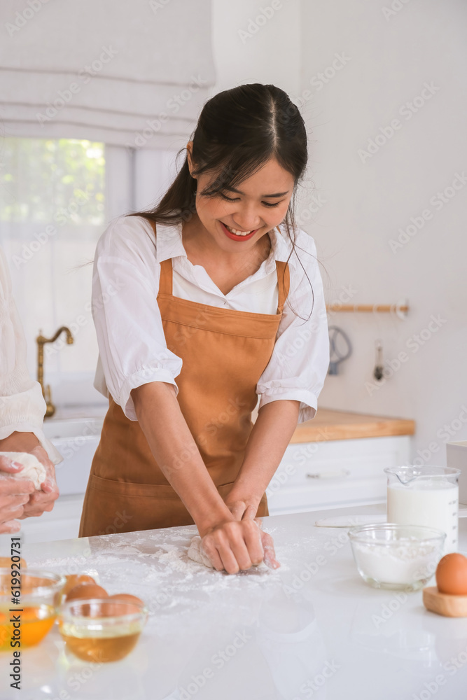 Woman kneading dough on the table. Woman kneading dough on the table.