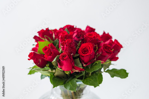 A large bouquet of red roses with green petals