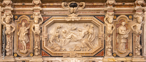 GENOVA, ITALY - MARCH 5, 2023: The marble relief of Burial of Jesus in church Basilica di Santa Maria delle Vigne by Anselmo Quadro (1643 - 1693).