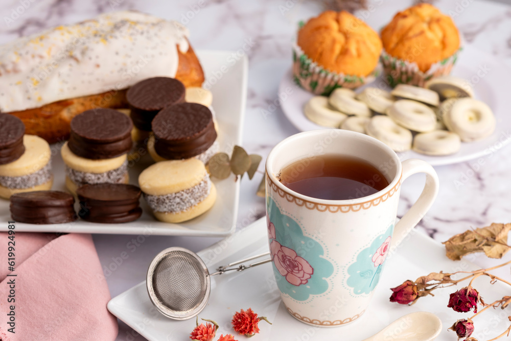breakfast and snack with tea and coffee with cornstarch and chocolate alfajores with mini donuts and muffins breakfast and snack with tea and coffee with cornstarch and chocolate alfajores with mini donuts and muffins