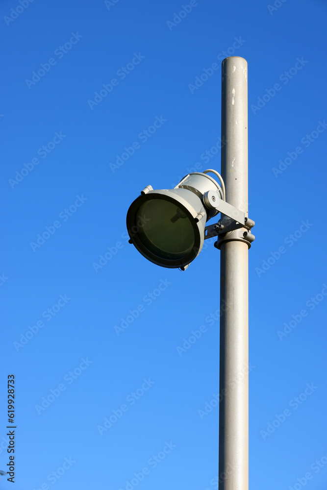 Urban spotlight tower with blue sky background Urban spotlight tower with blue sky background