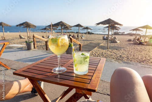 Drinking cocktails in a beach bar in Porto Portugal Porto tonic