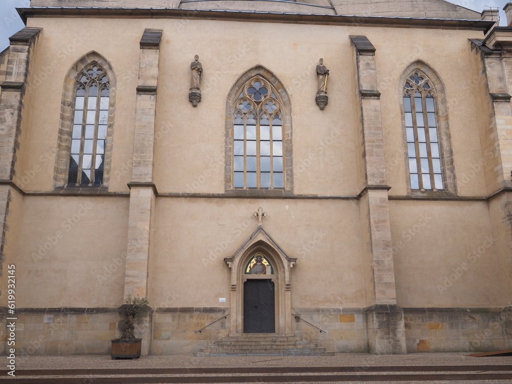Extra wall, gothic windows and entrance of 