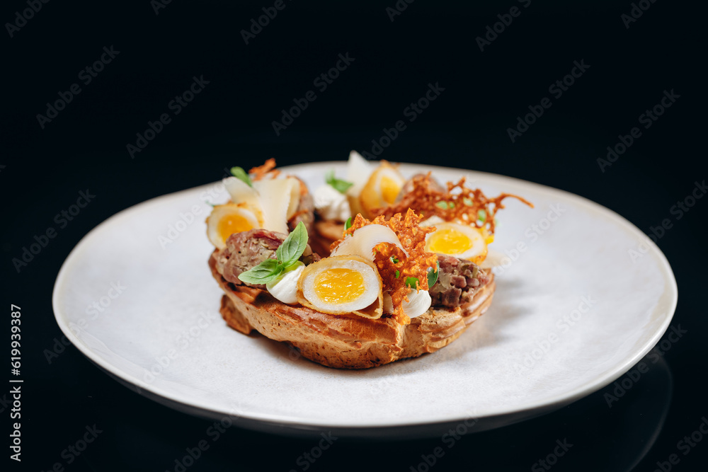 Bruschetta with meat and quail eggs