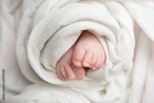 twisted child. Soft feet of a newborn. © Svetlana