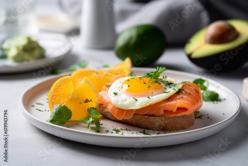 Leinwand Poster Healthy keto breakfast with eggs, salmon and avocado on a plate, restaurant serving
