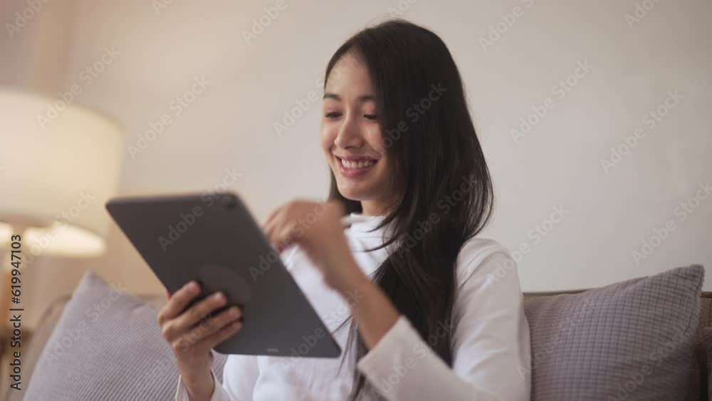 Young asian girl using digital tablet reading e-book for online learning. Young asian girl using digital tablet reading e-book for online learning.