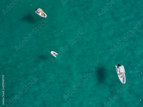 Italy, July 2023: aerial drone view of caribbean sea and flying boats with shadow at Riaci Bay near Tropea in Calabria © cristian