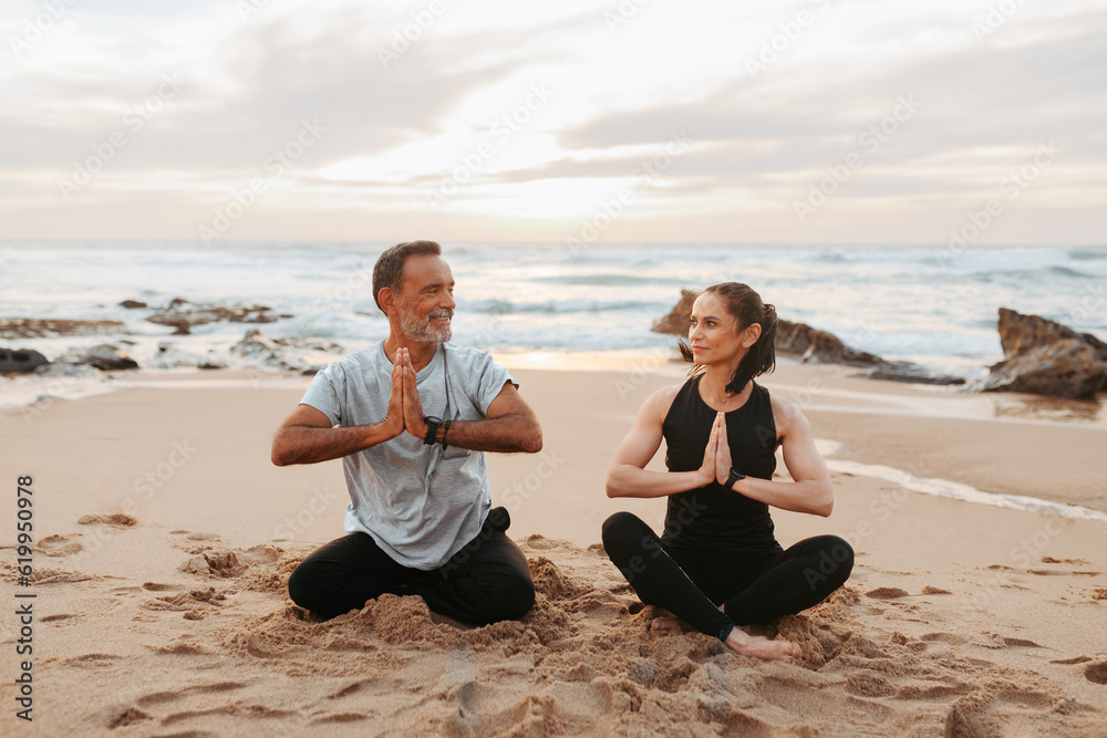 Cheerful senior caucasian lady and man in sportswear practice yoga and breathing, mental exercises, enjoy training Cheerful senior caucasian lady and man in sportswear practice yoga and breathing, mental exercises, enjoy training