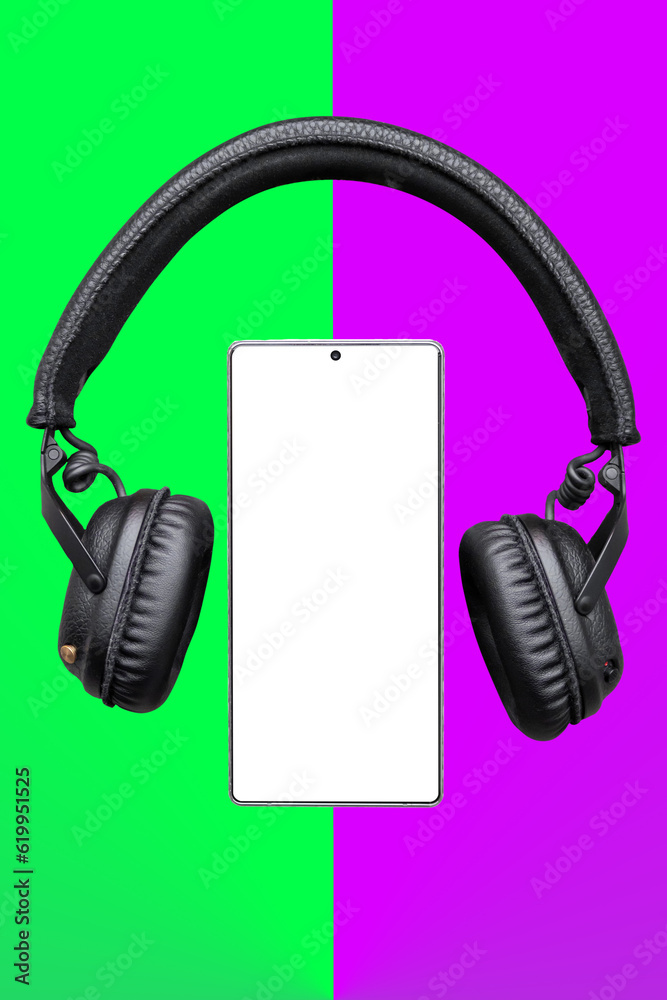 Mobile phone with empty screen and Headphones, Earphones on green and purple surface / Mobile phone screen mockup with black headphones / listening music, audio, podcast app Mobile phone with empty screen and Headphones, Earphones on green and purple surface / Mobile phone screen mockup with black headphones / listening music, audio, podcast app