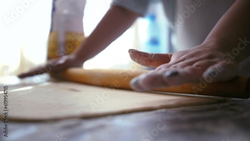 Dough Rolling Mastery: Woman's Art of Crafting Perfect Pastries