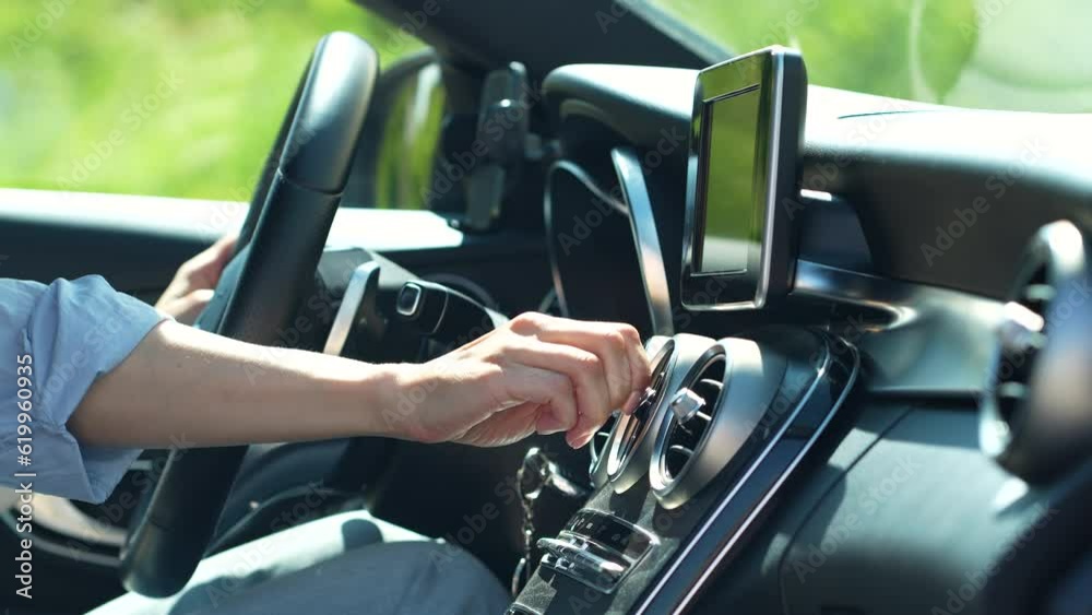 Heat and car driving. Female hand checking flow cold air from conditioner, suffering from summer hot weather. Woman driver sets comfortable temperature inside car closeup. Heat and car driving. Female hand checking flow cold air from conditioner, suffering from summer hot weather. Woman driver sets comfortable temperature inside car closeup.