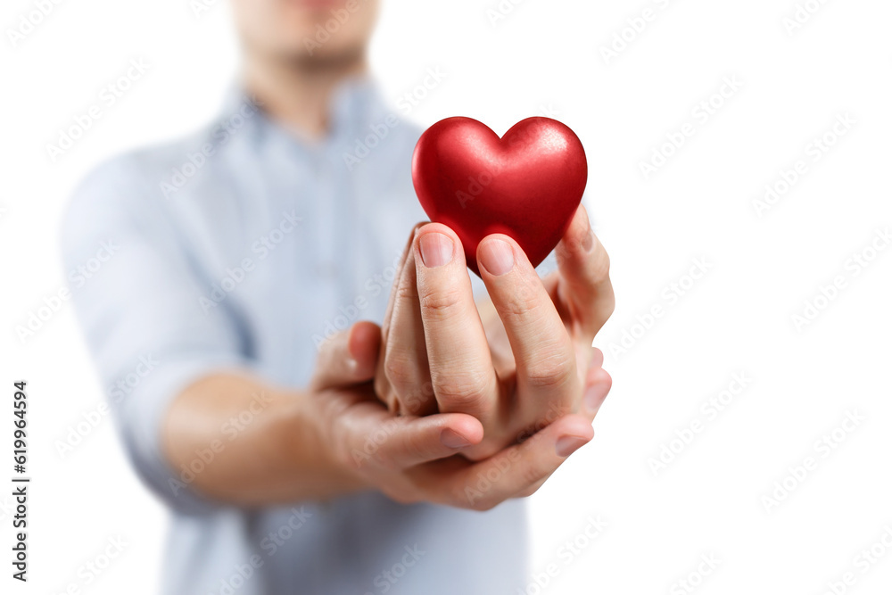 Male hand holding a red small heart, cut out