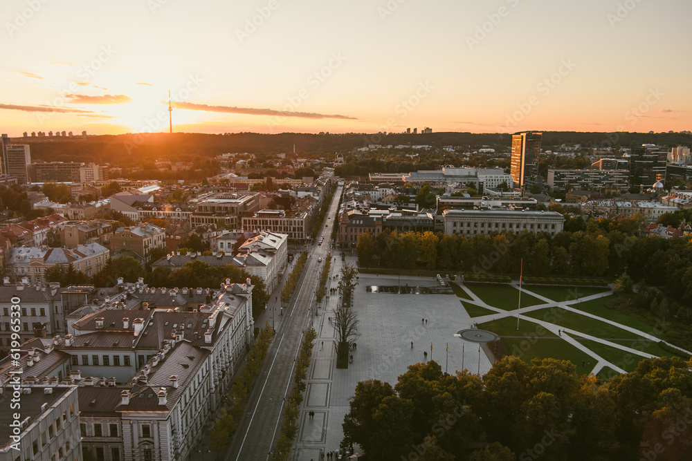 Beautiful aerial evening view of Vilnius Old Town with scenic sunset illumination. City life in Vilnius, Lithuania.