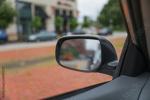 car mirror reflects both practicality and introspection, symbolizing self-reflection, awareness, and the ability to navigate life's paths with foresight