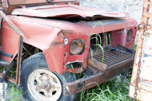 Ravaged Red Off-Road Vehicle: A Glimpse of Destruction