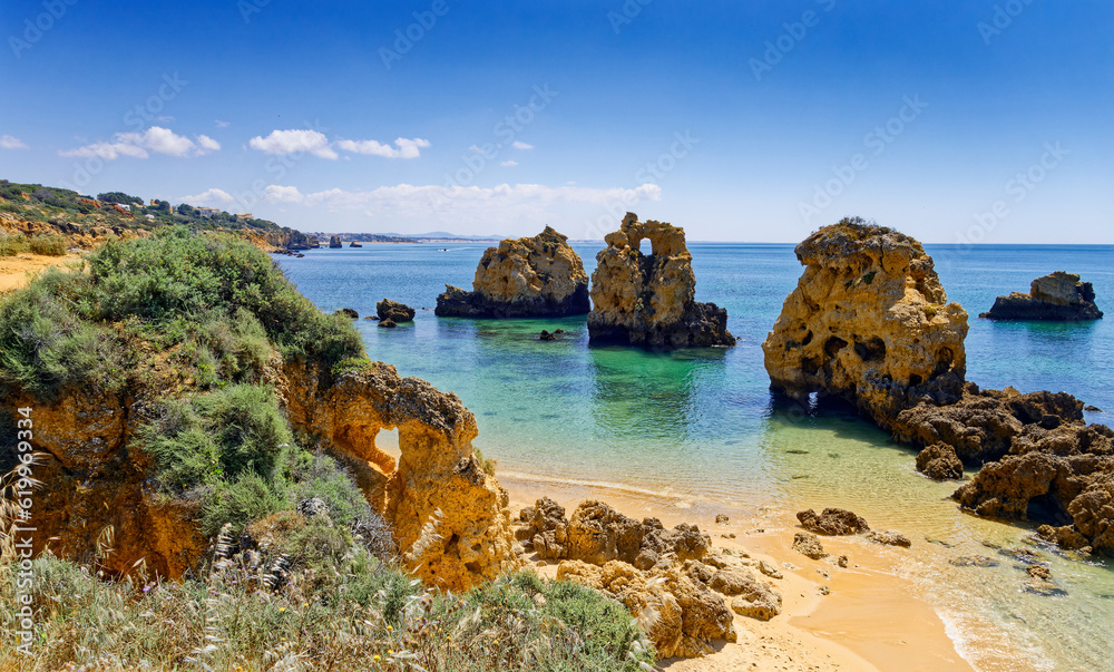 Beautiful cliffs and crystal clear turquoise water of Praia de Arrifes, Algarve, Portugal