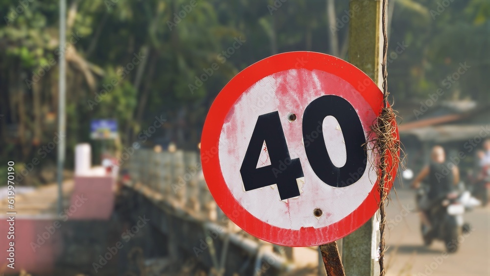 Close-up image of a speed limit sign indicating a maximum speed of less than 40