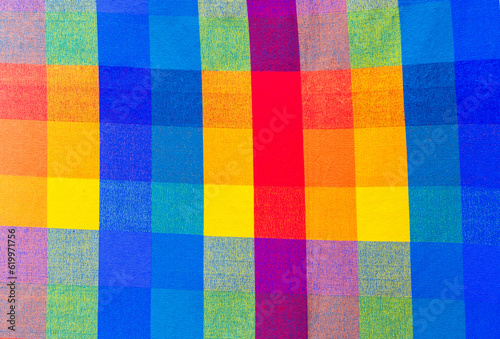 colorful cultural textiles and pride flags