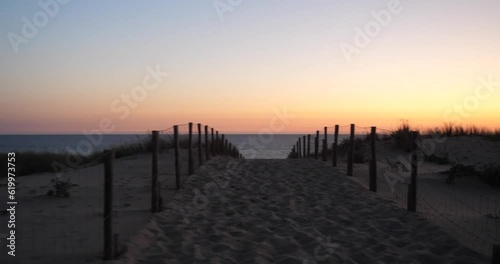 Wallpaper Mural A small path on the dunes of sand and the Atlantic Ocean in the background. Cap Ferret, France - June 2023. Torontodigital.ca