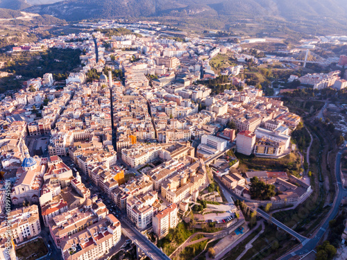 View from drone of residential areas of Spanish town of Alcoy with Iglesia arciprestal de Santa Maria