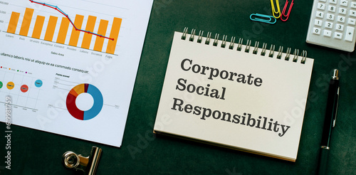 There is notebook with the word Corporate Social Responsibility. It is as an eye-catching image.