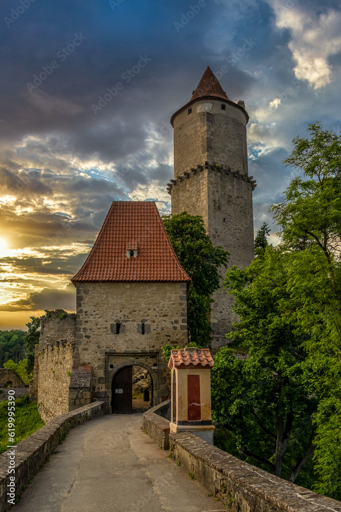 Sunset dramatic sky view of Zvikov medieval castle gate and keep with attacking angle in Bohemia Sunset dramatic sky view of Zvikov medieval castle gate and keep with attacking angle in Bohemia
